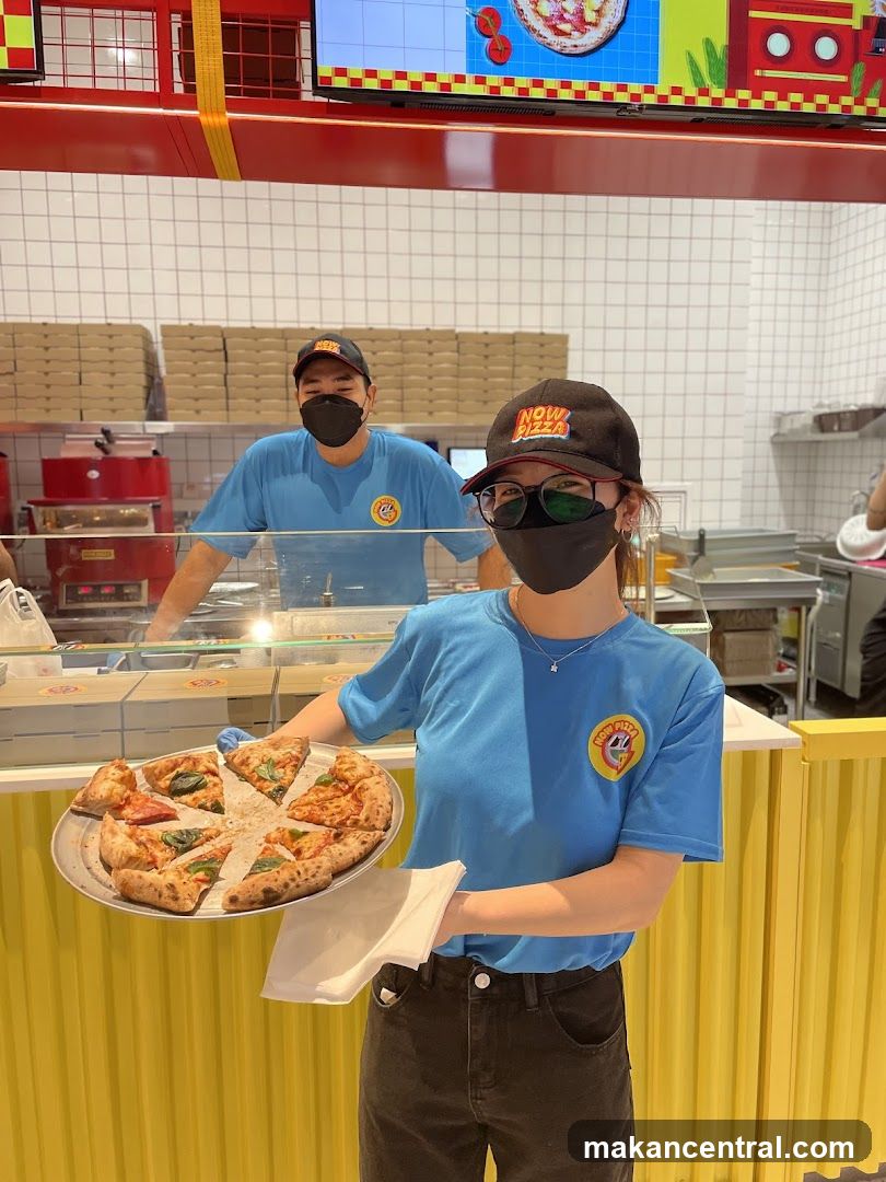 NOW PIZZA staff inside restaurant