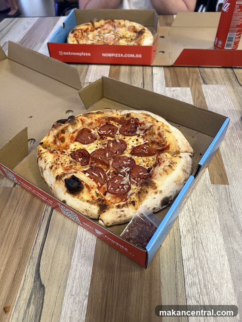 Pizza in Box on Wooden Table