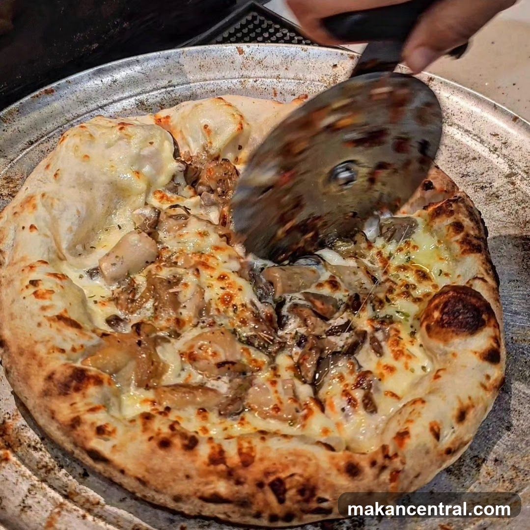Pizza being sliced