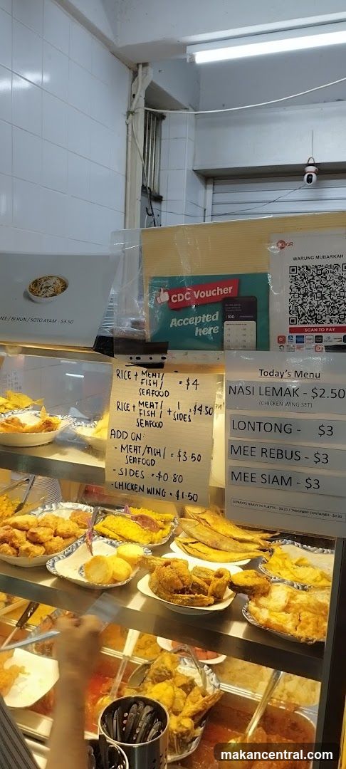 Food stall interior with display counter and signage
