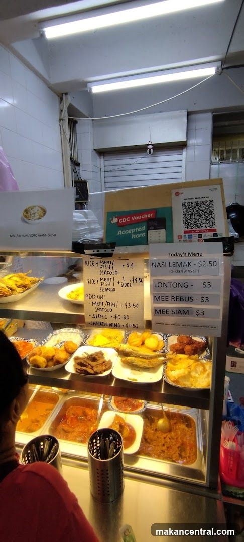 Food stall interior with display counter and menu board