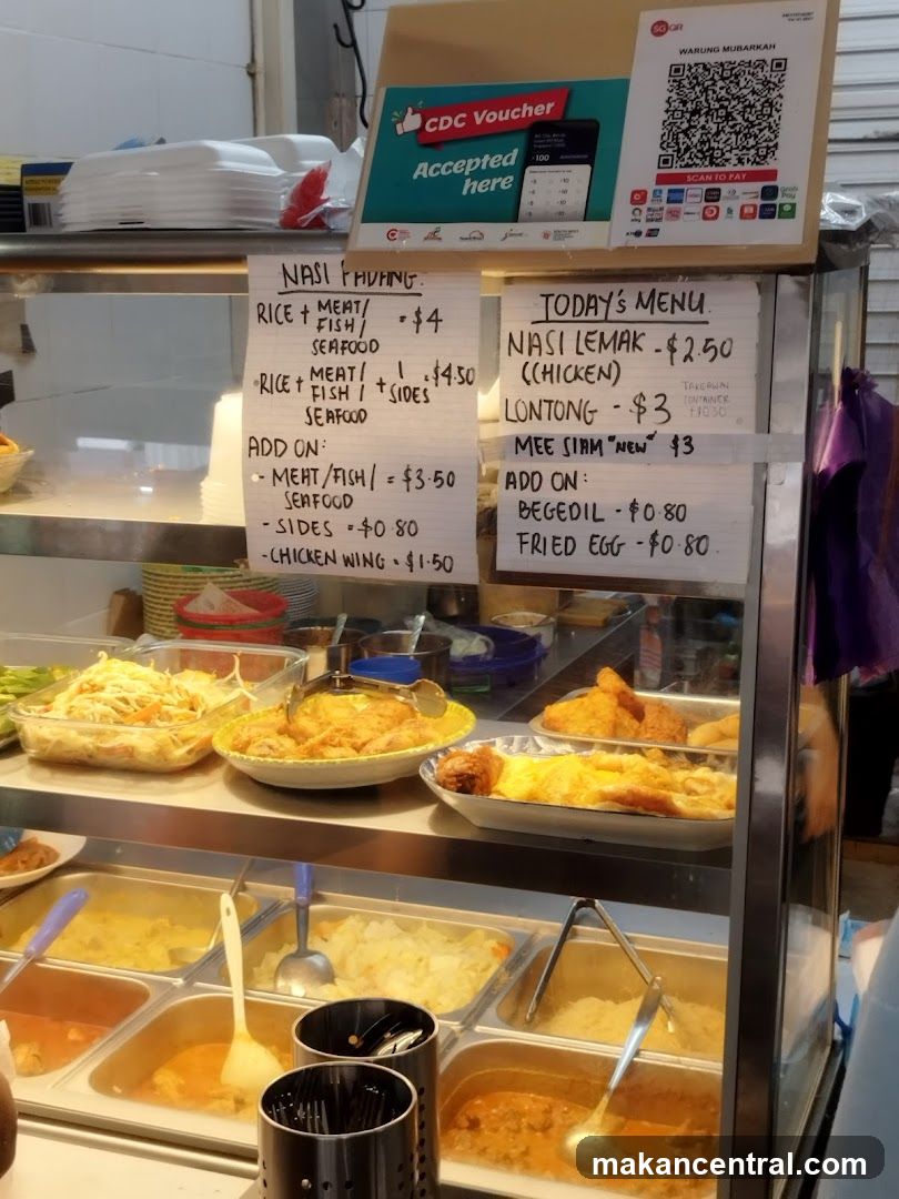 Food stall display with handwritten menus and CDC voucher sign