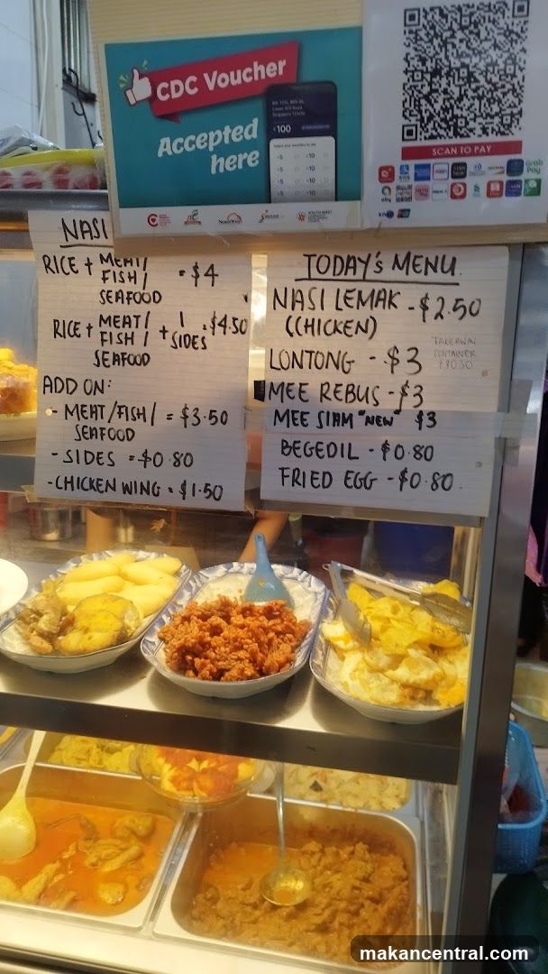 Food stall display with handwritten menus and payment options