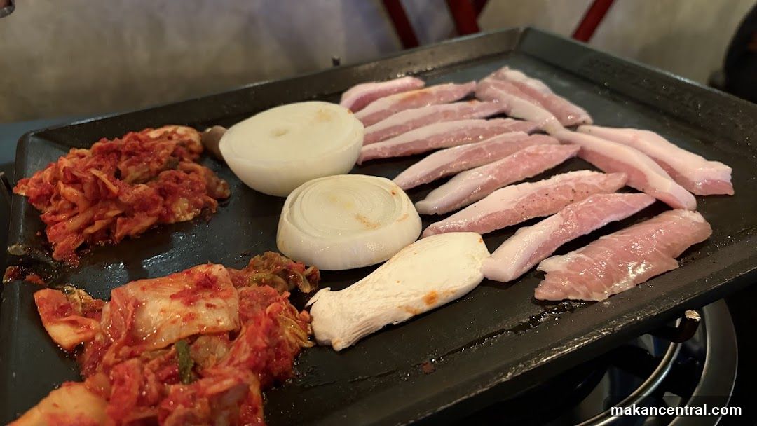 Grilled meat and vegetables on a griddle