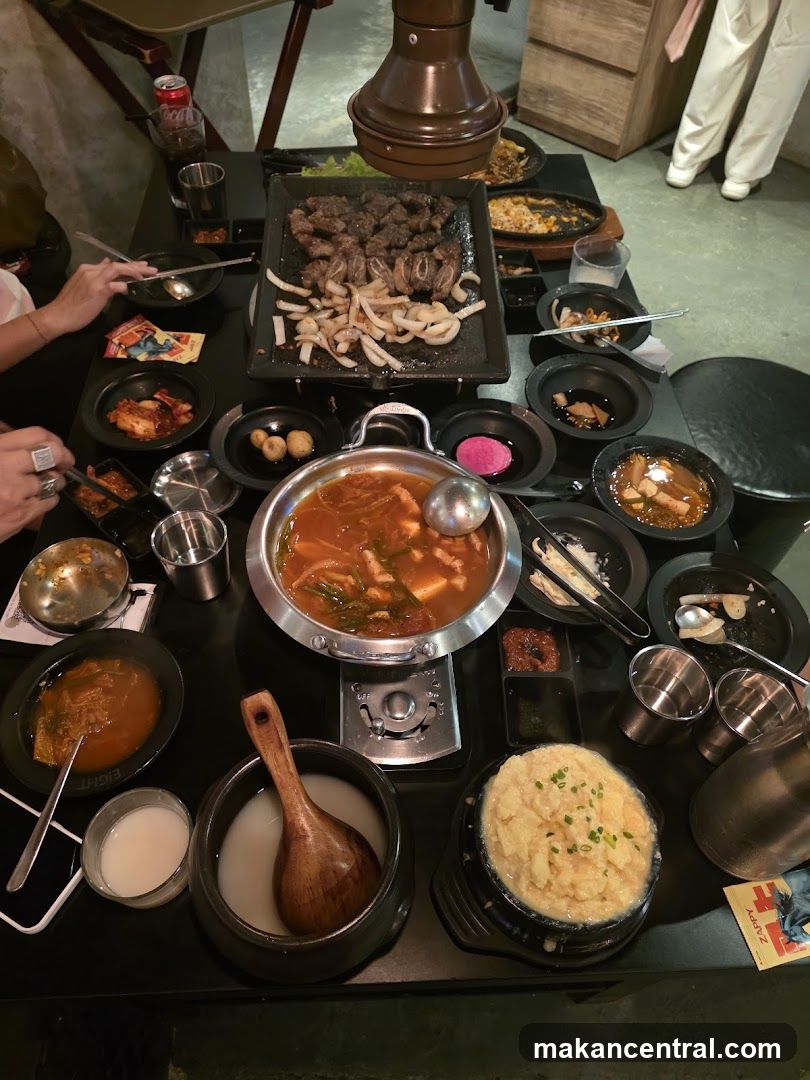 Table with Korean BBQ and side dishes