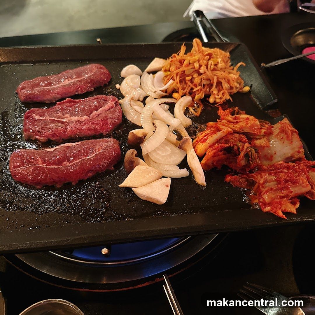 Grilled meat and vegetables on a hot plate