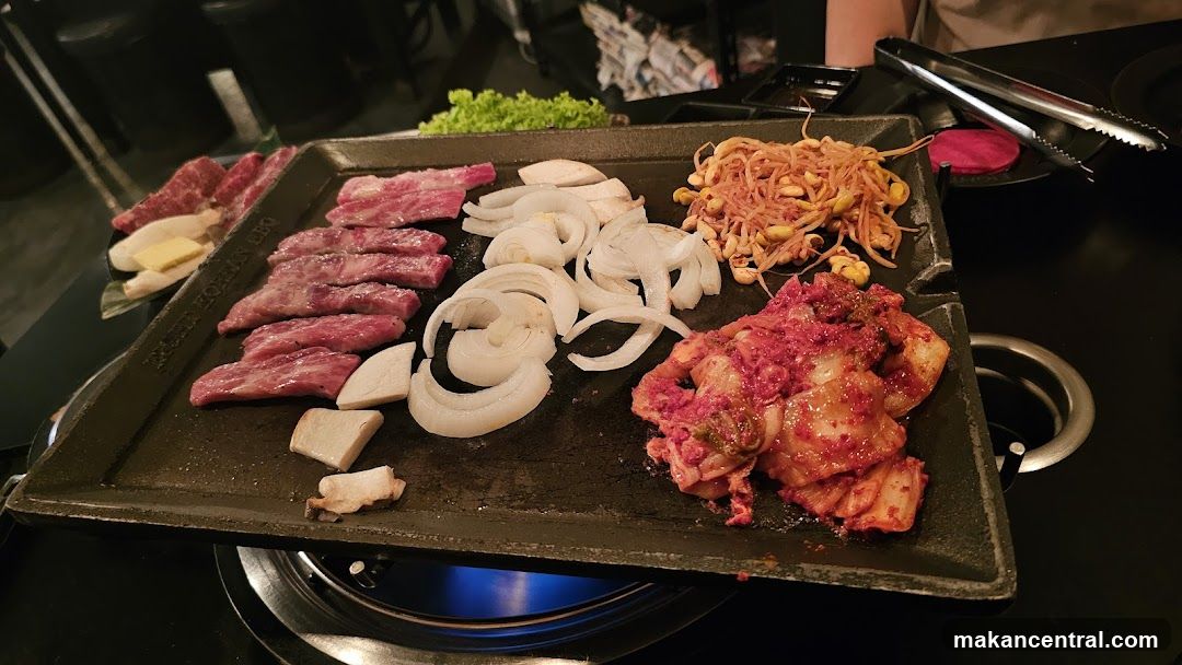 Grilled meat and vegetables on a hot plate