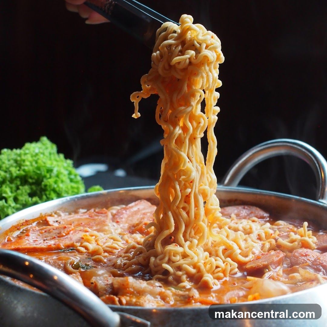 Noodles being lifted from a pot