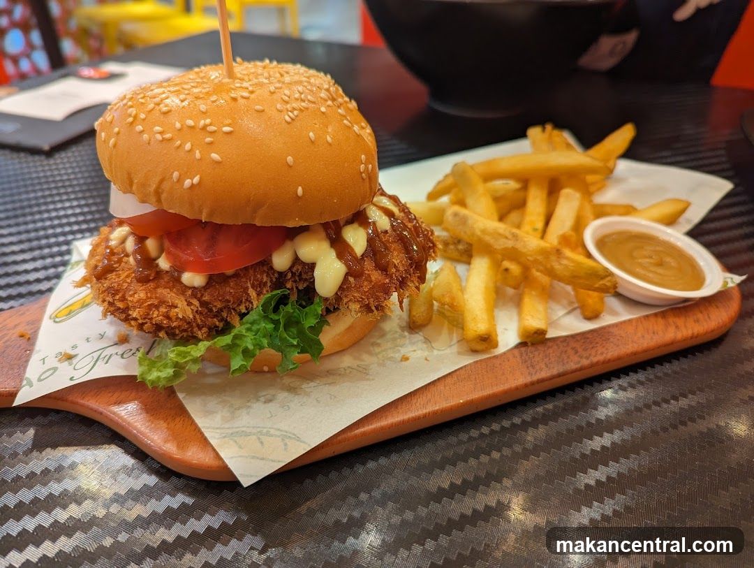 Burger and fries on wooden tray