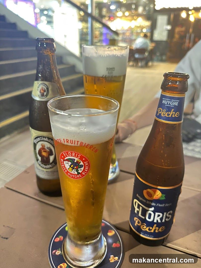 Beer glasses and bottles on table