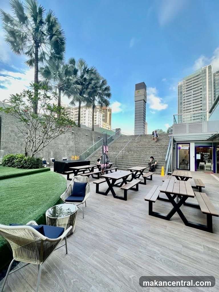 Outdoor seating area with urban backdrop