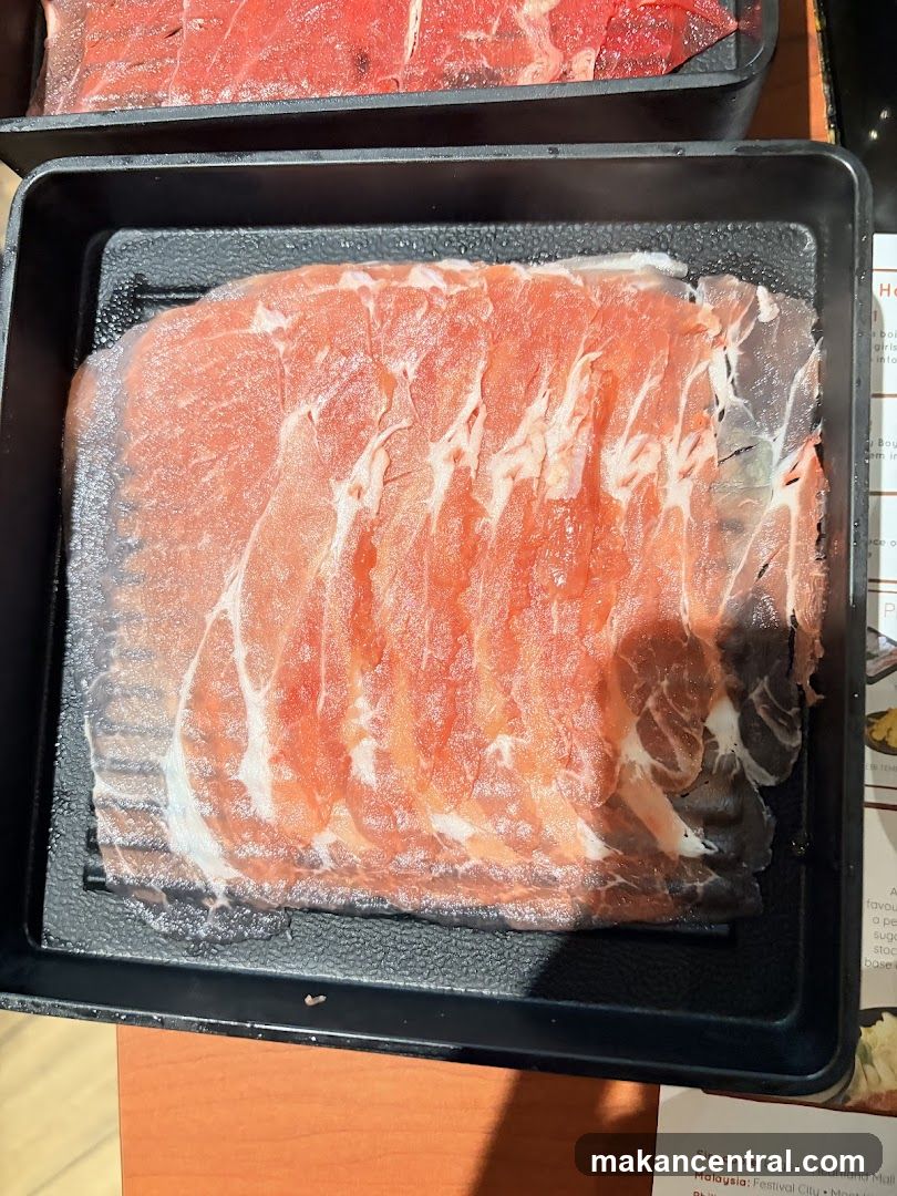 Raw meat slices on tray