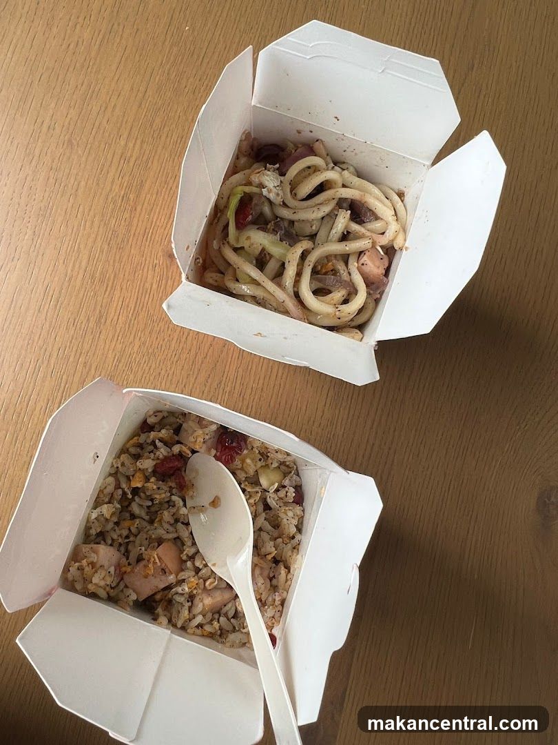 Two takeout containers on wooden surface