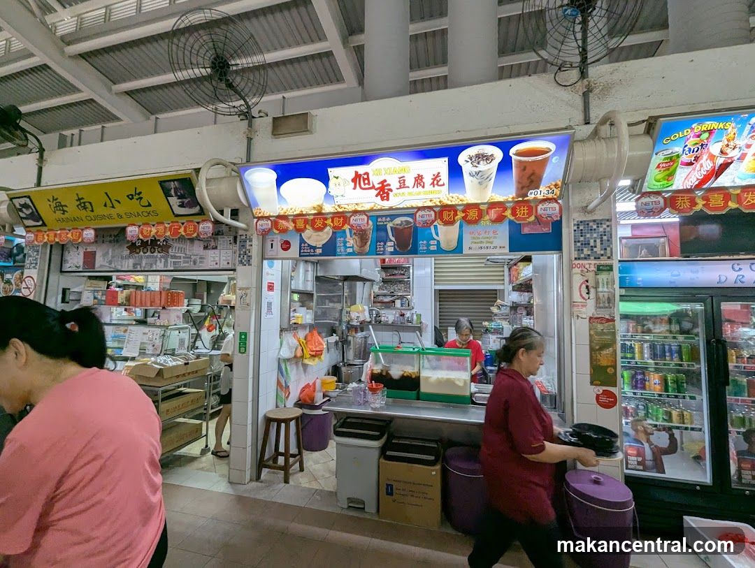 Food stall interior with staff and customers