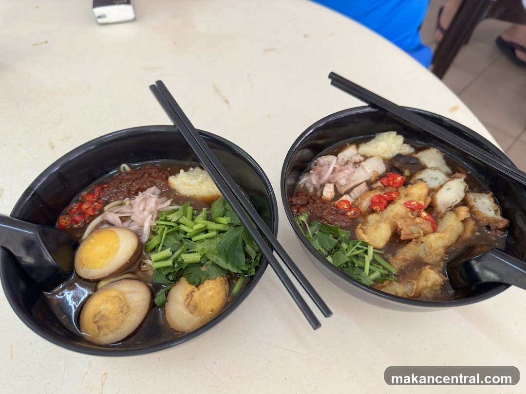 Two bowls of noodle soup on a table