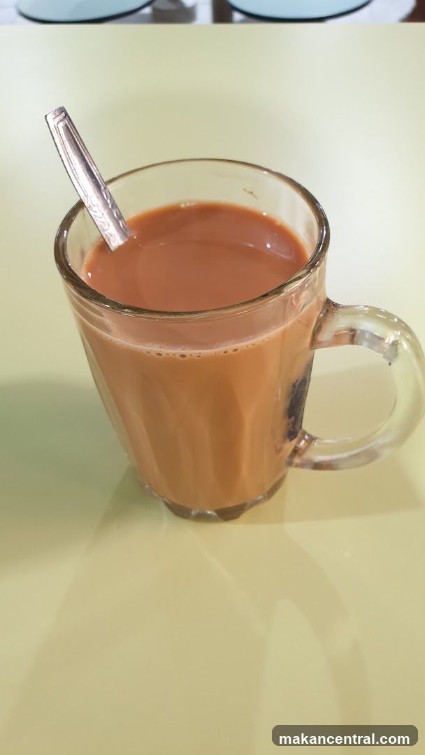 Tea in glass mug with spoon