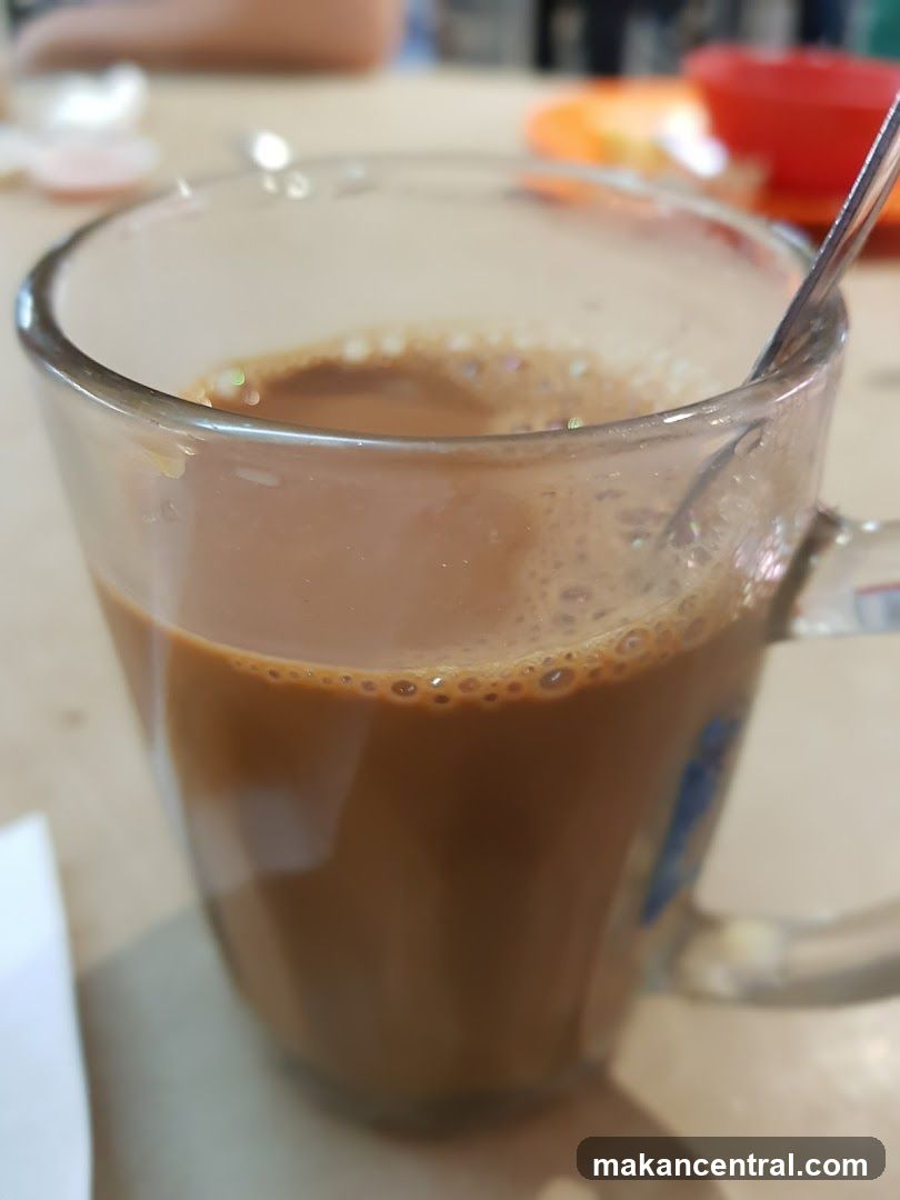 Cup of beverage with spoon