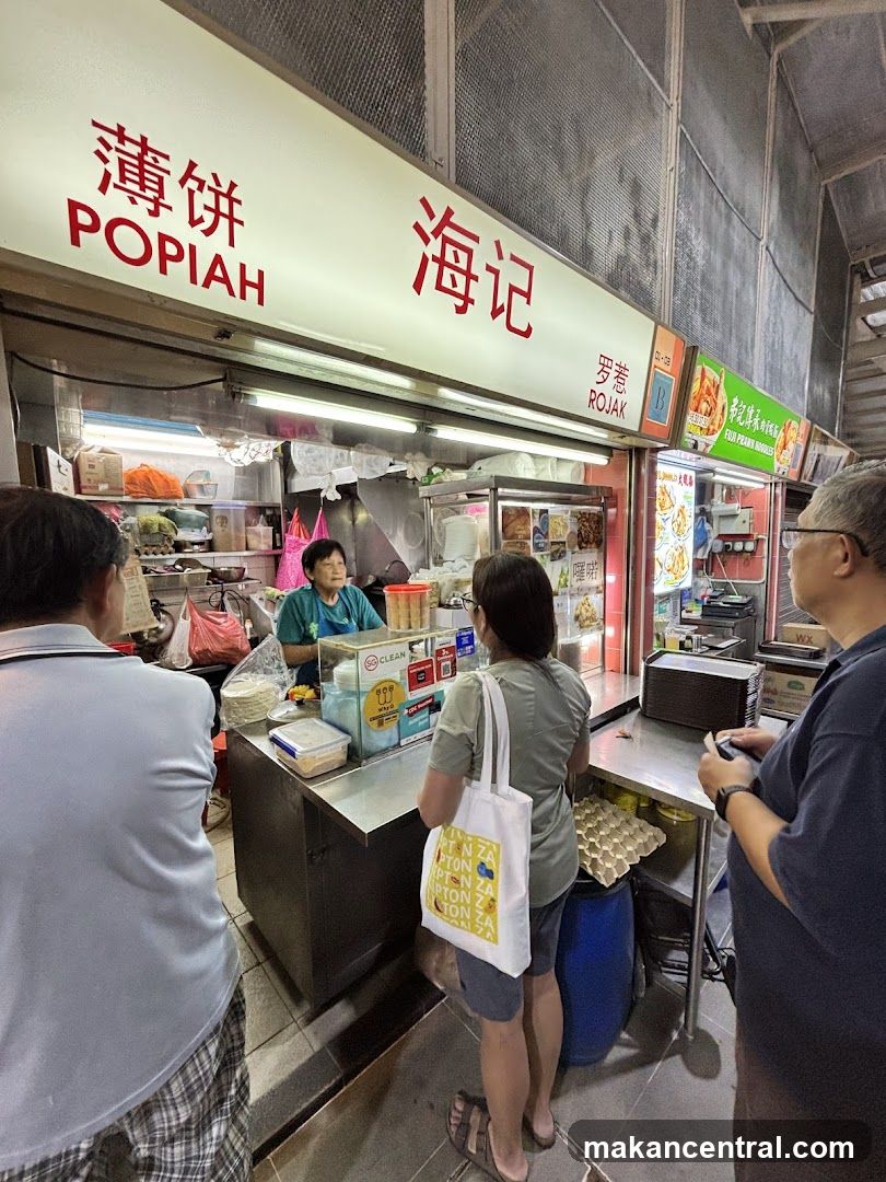 Food stall interior with customers and staff