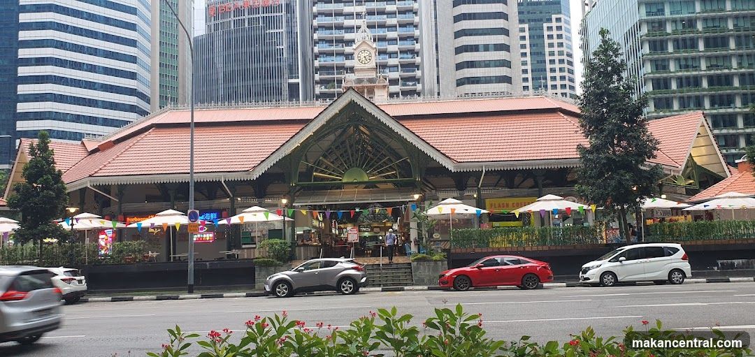 Outdoor market facade with modern city backdrop