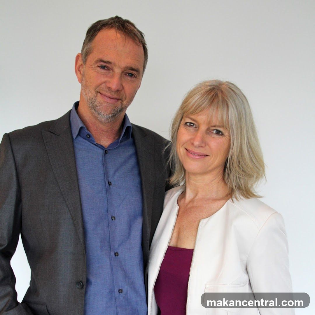 Two individuals posing for a portrait