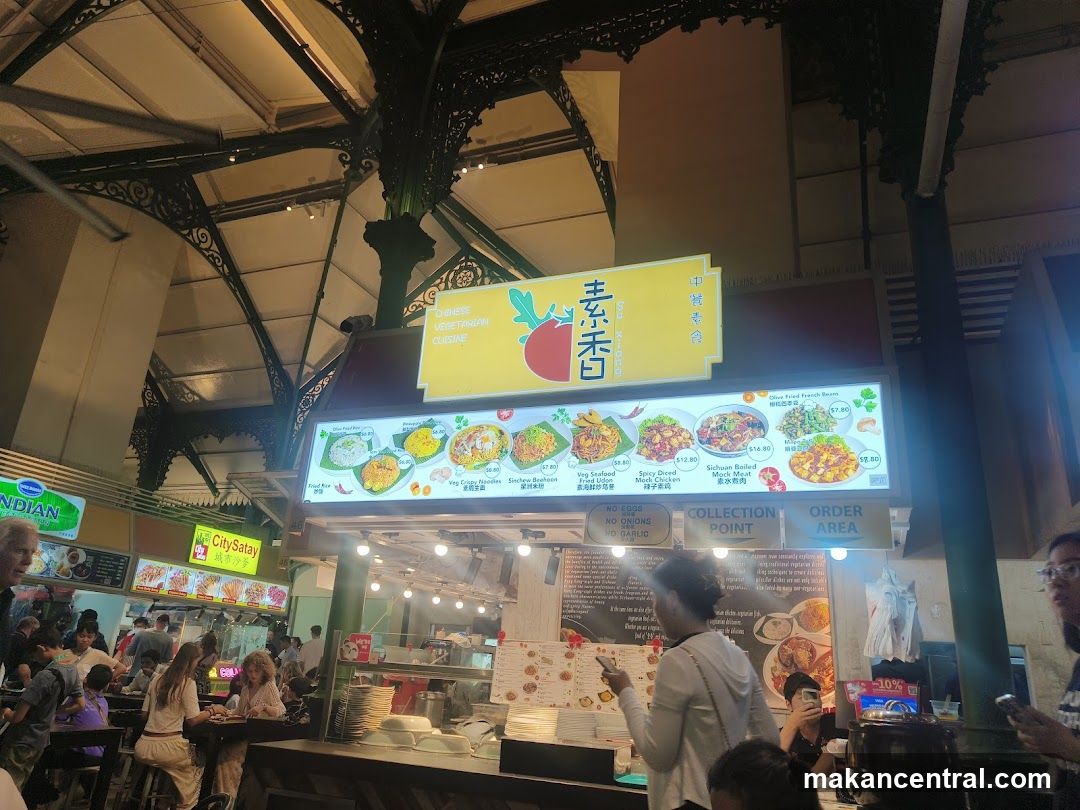 Food stall interior with Chinese vegetarian cuisine sign
