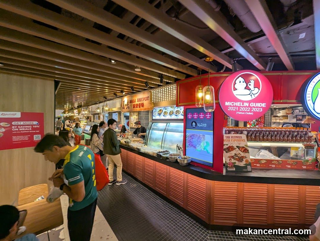 Food court interior with Michelin Guide signage