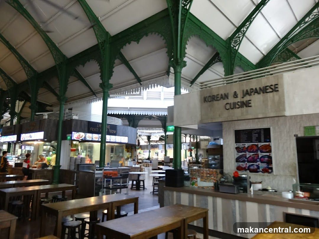 Interior of a food court with green metal framework