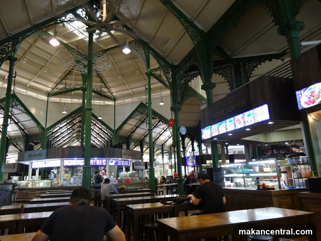 Interior of a food court with green metal architecture
