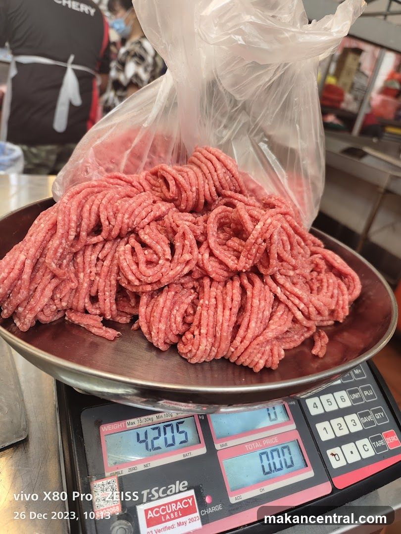 Raw meat on scale at market stall