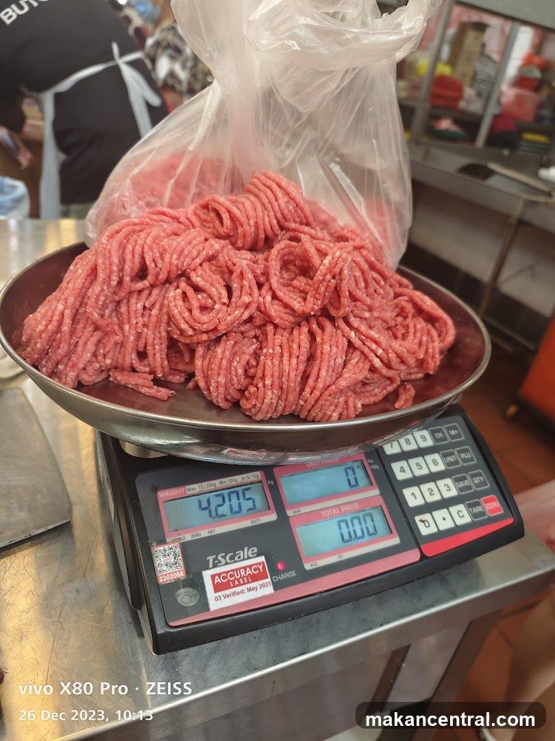 Raw meat on scale in butcher shop