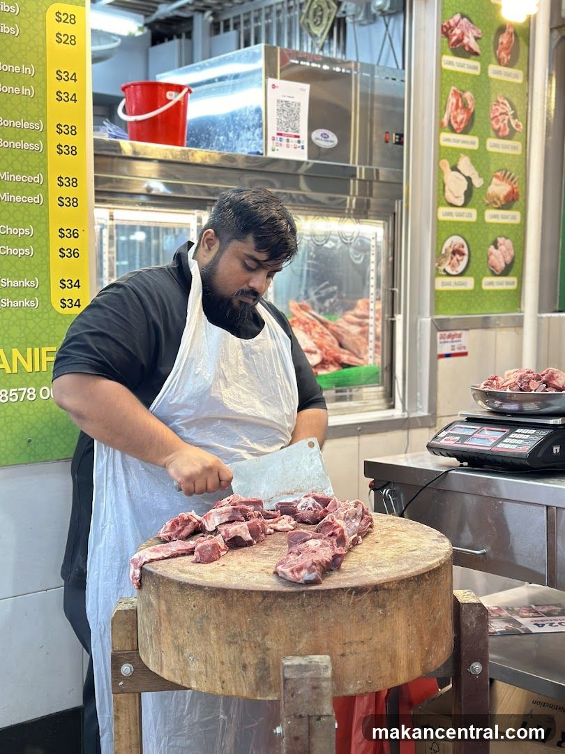 Butcher at meat stall