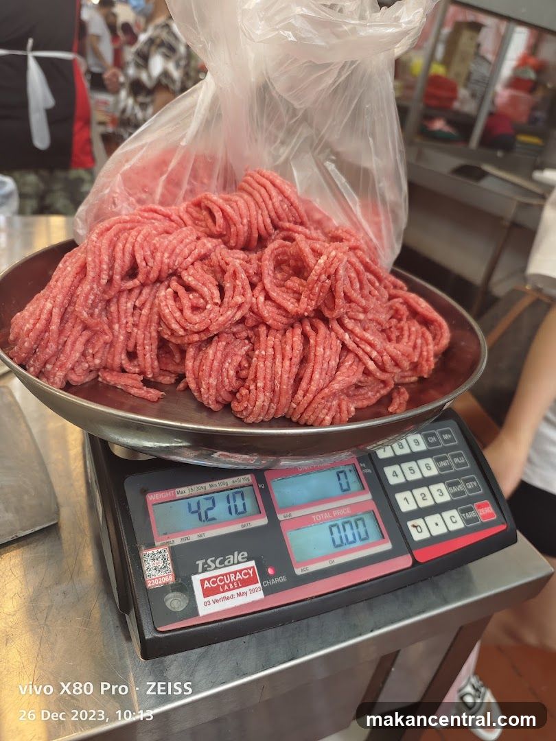 Raw meat on scale at market stall