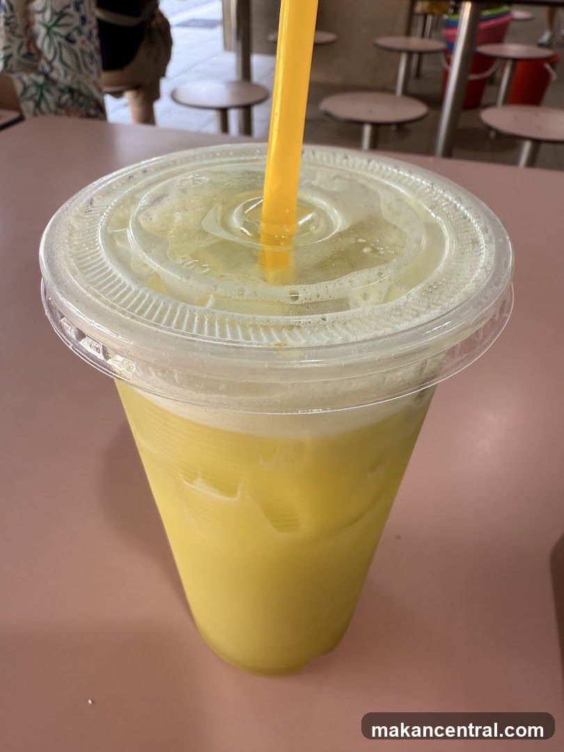 Yellow beverage with straw