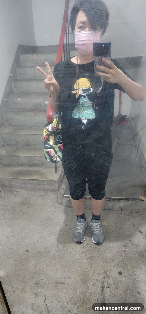 Person taking selfie in front of staircase
