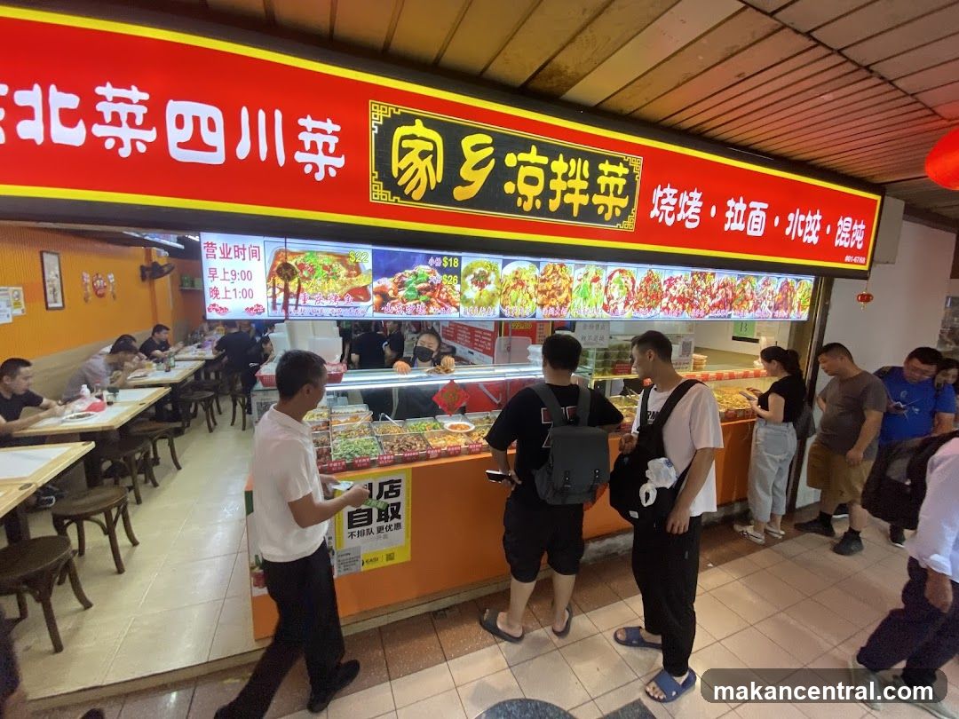 Food stall interior with customers and staff