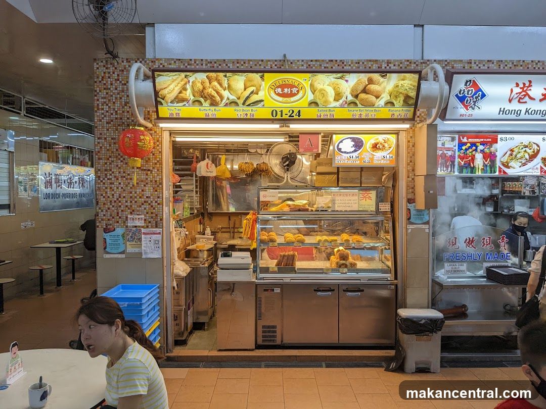 Food stall interior with display case and signage
