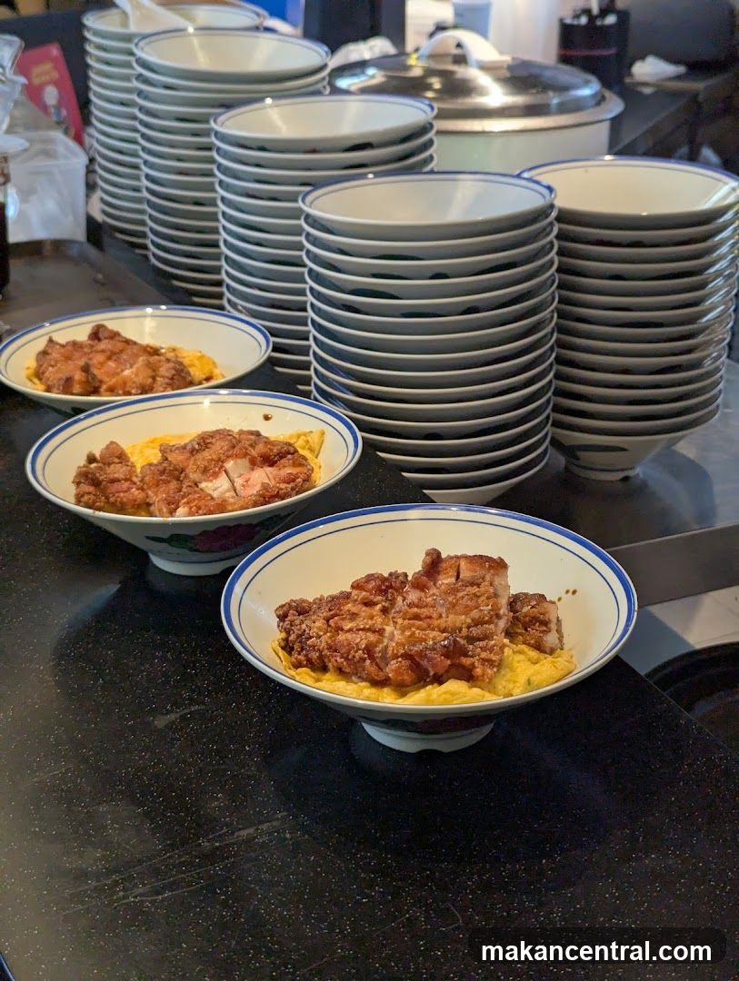 Bowl of Fried Chicken over Egg