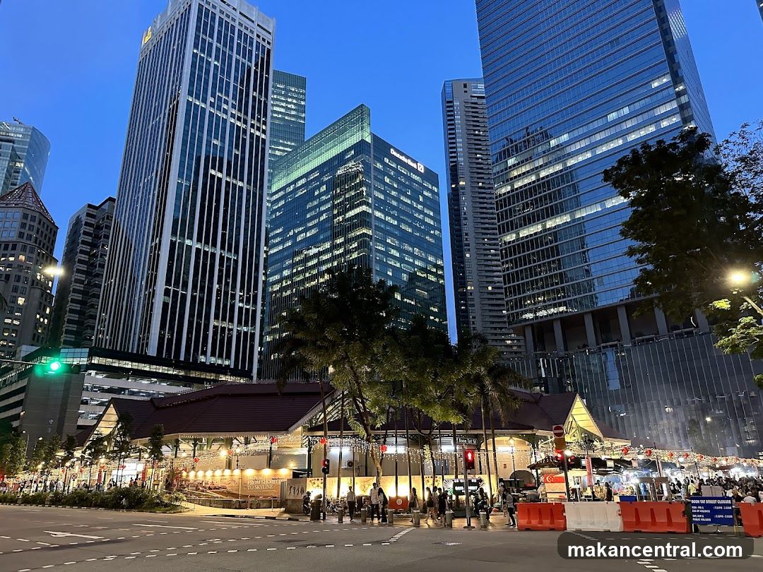 Urban Night Scene with Skyscrapers and Street Market