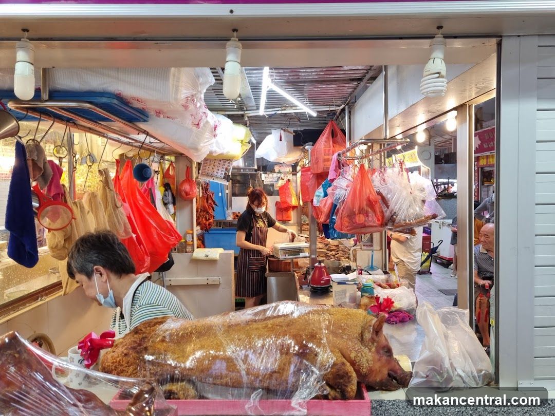 Food stall interior with roasted pig display