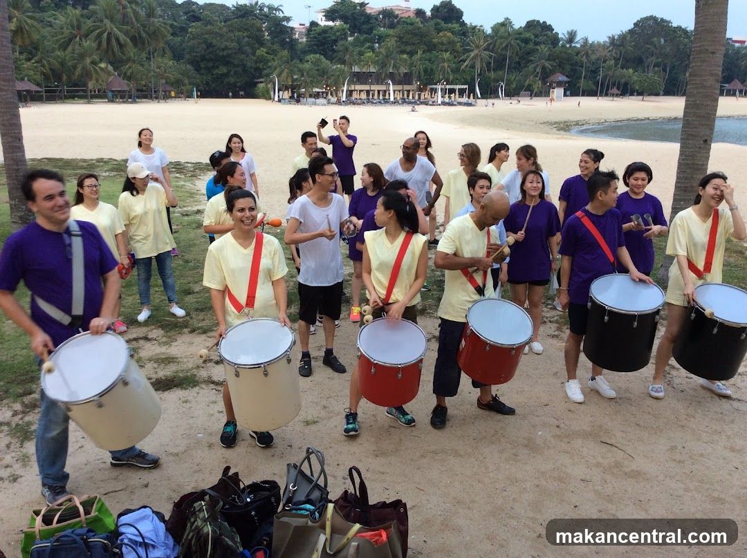 Group on Beach with Drums