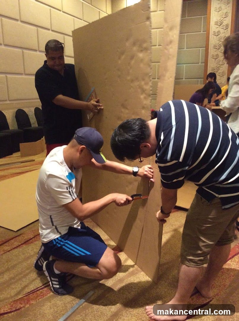 Group working on cardboard structure