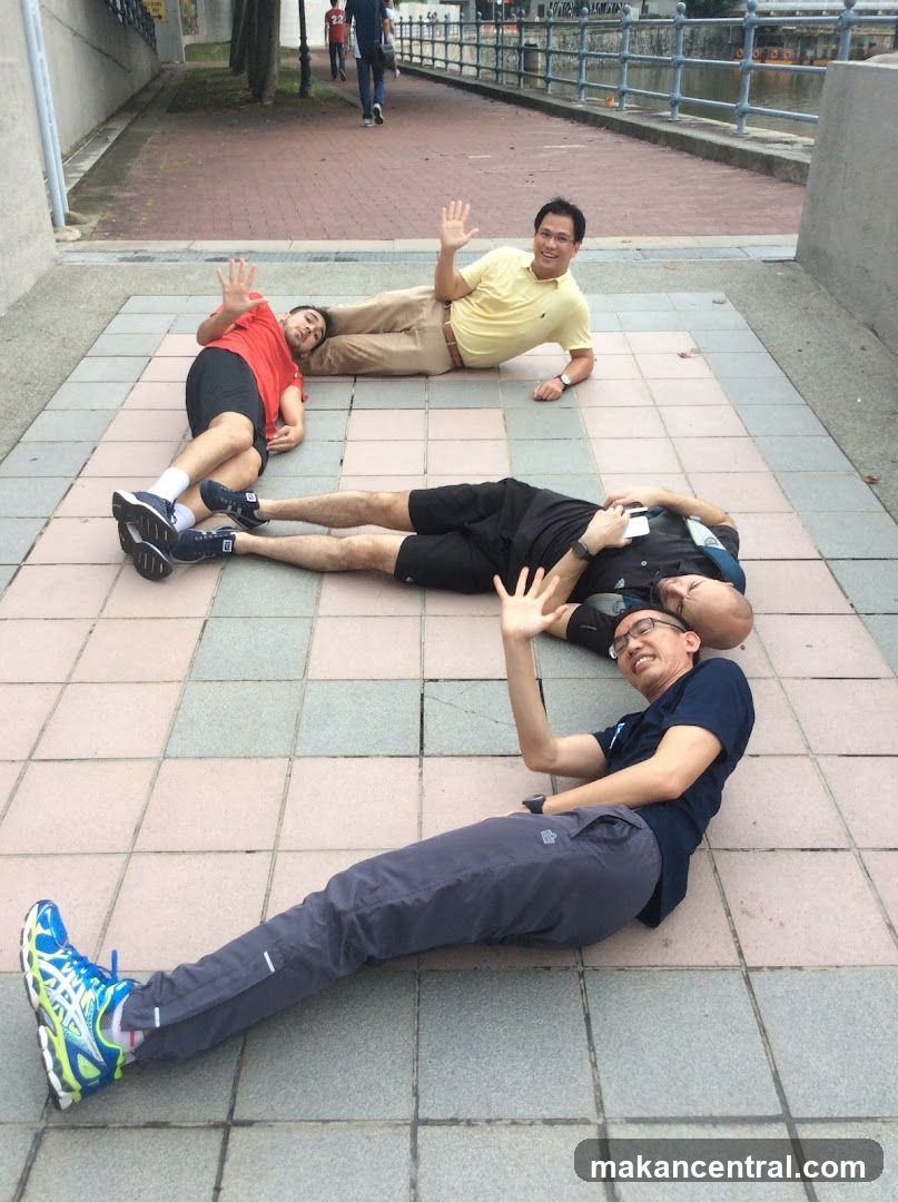 Group of men posing on pavement