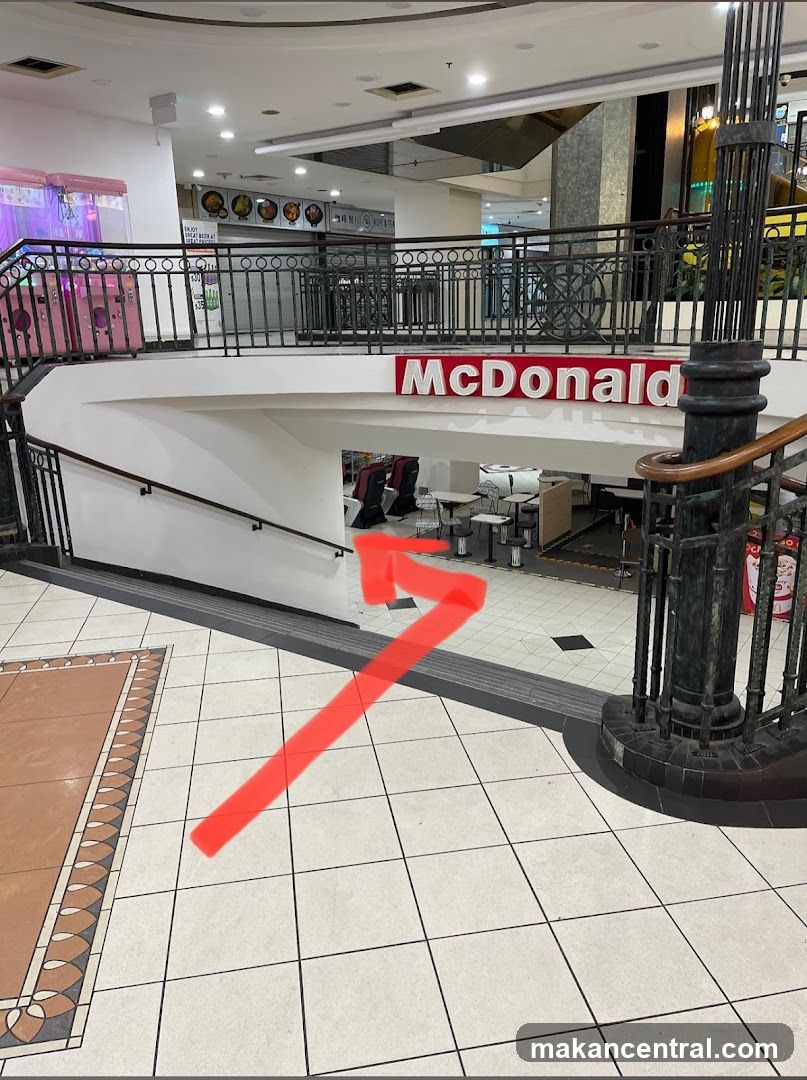Interior of shopping mall with McDonald's sign