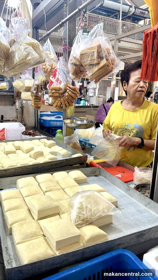 Market stall selling tofu and snacks