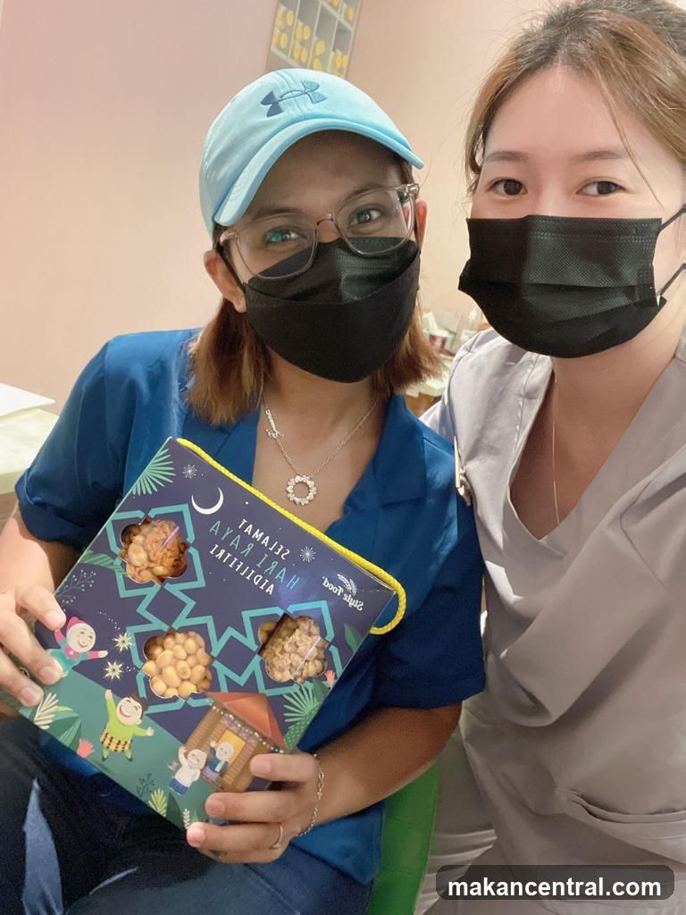 Two Women with a Box of Snacks