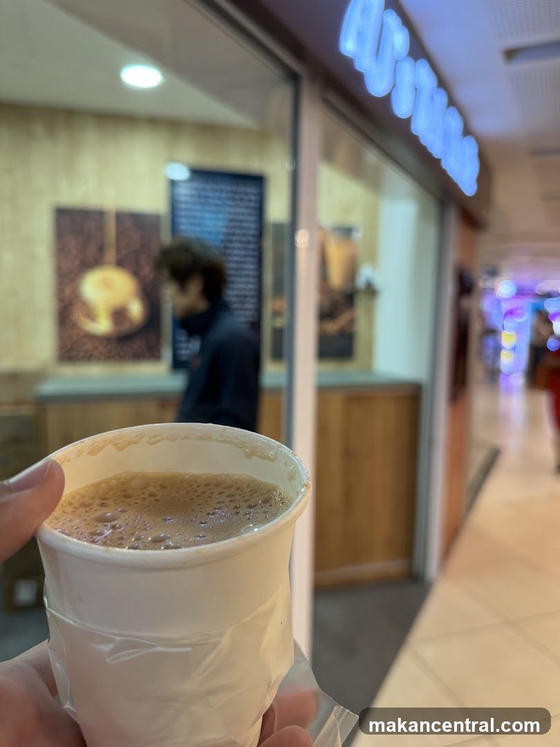 Coffee cup in front of a shop