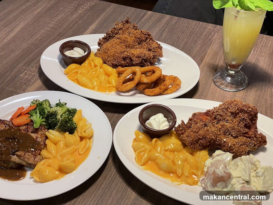 Three Plates of Food and a Drink