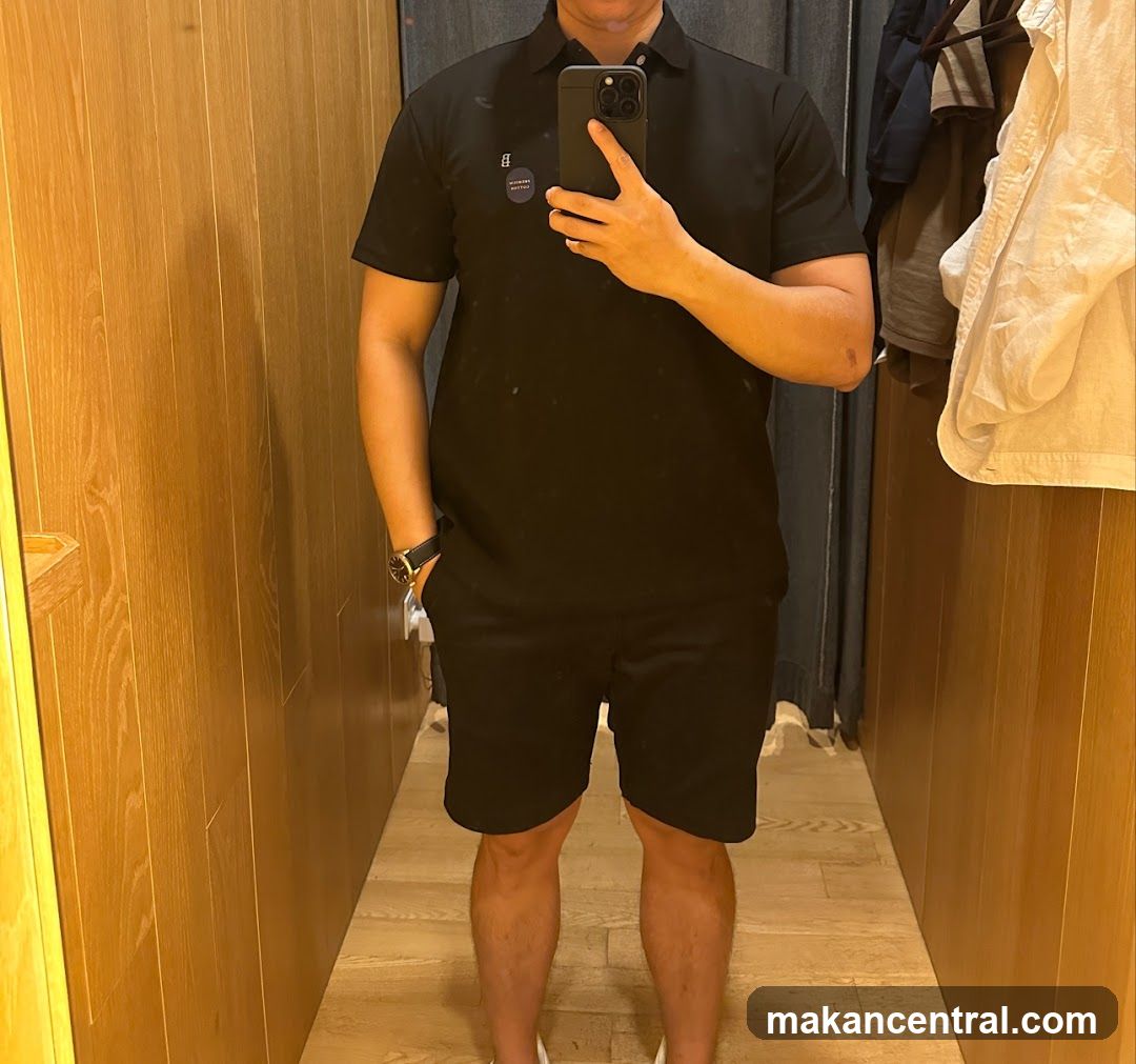 Man in Black Polo and Shorts