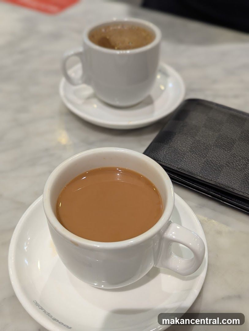 Two cups of coffee on a marble table