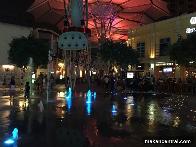Nighttime Fountain Plaza with Restaurants